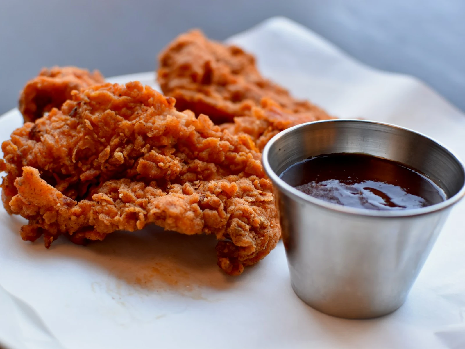 Chicken Strips on white paper napkins