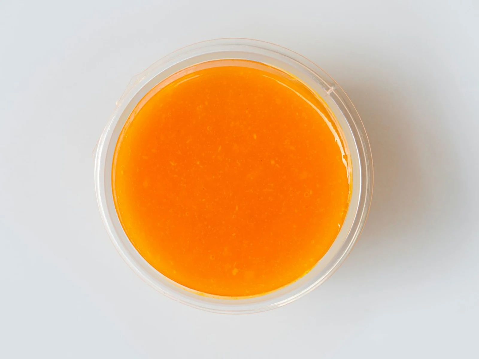 Single serve container of Zesty Buffalo Sauce