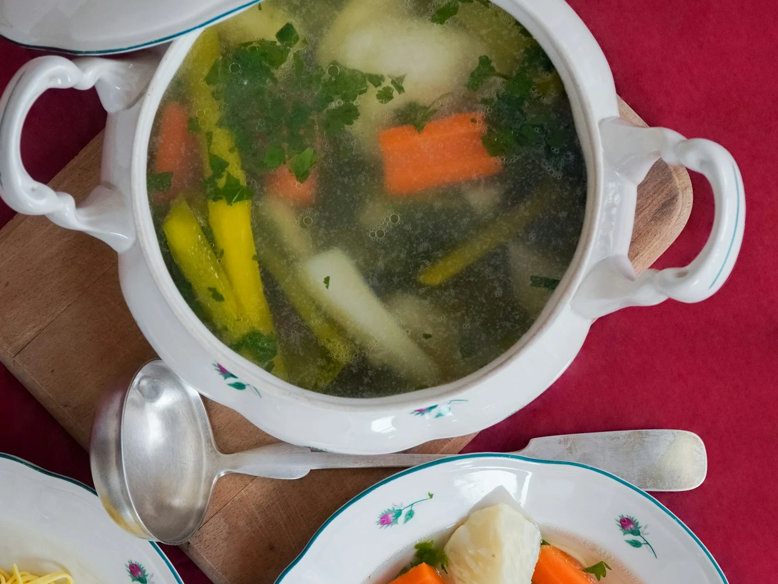 Chicken noodle soup in a white cup